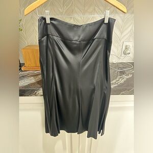 Black satin fit and flare midi skirt. Size 4.